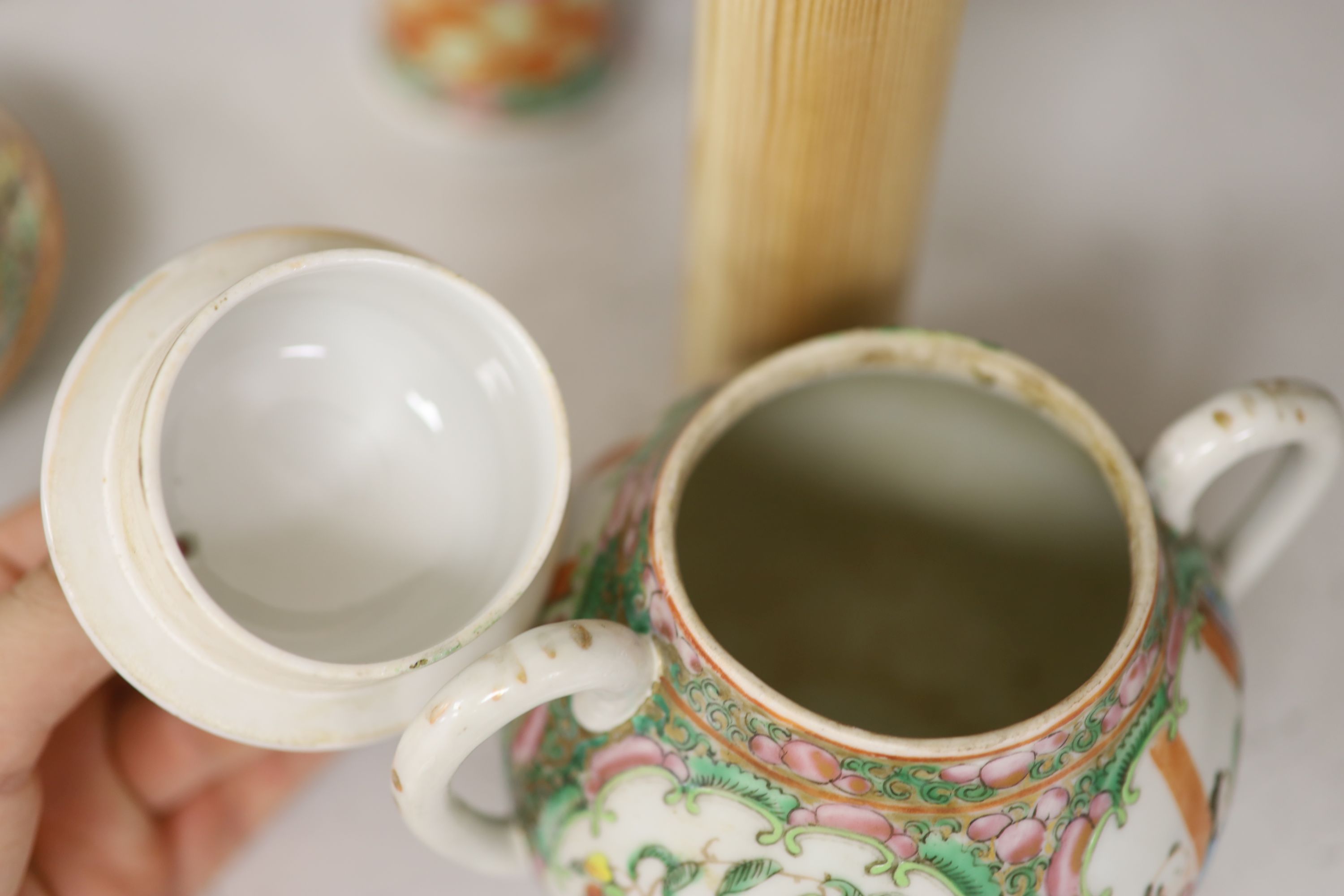 A Chinese famille rose box and cover, two vases, a sugar bowl and cover and a saucer, late 19th/early 20th century, tallest 19cm